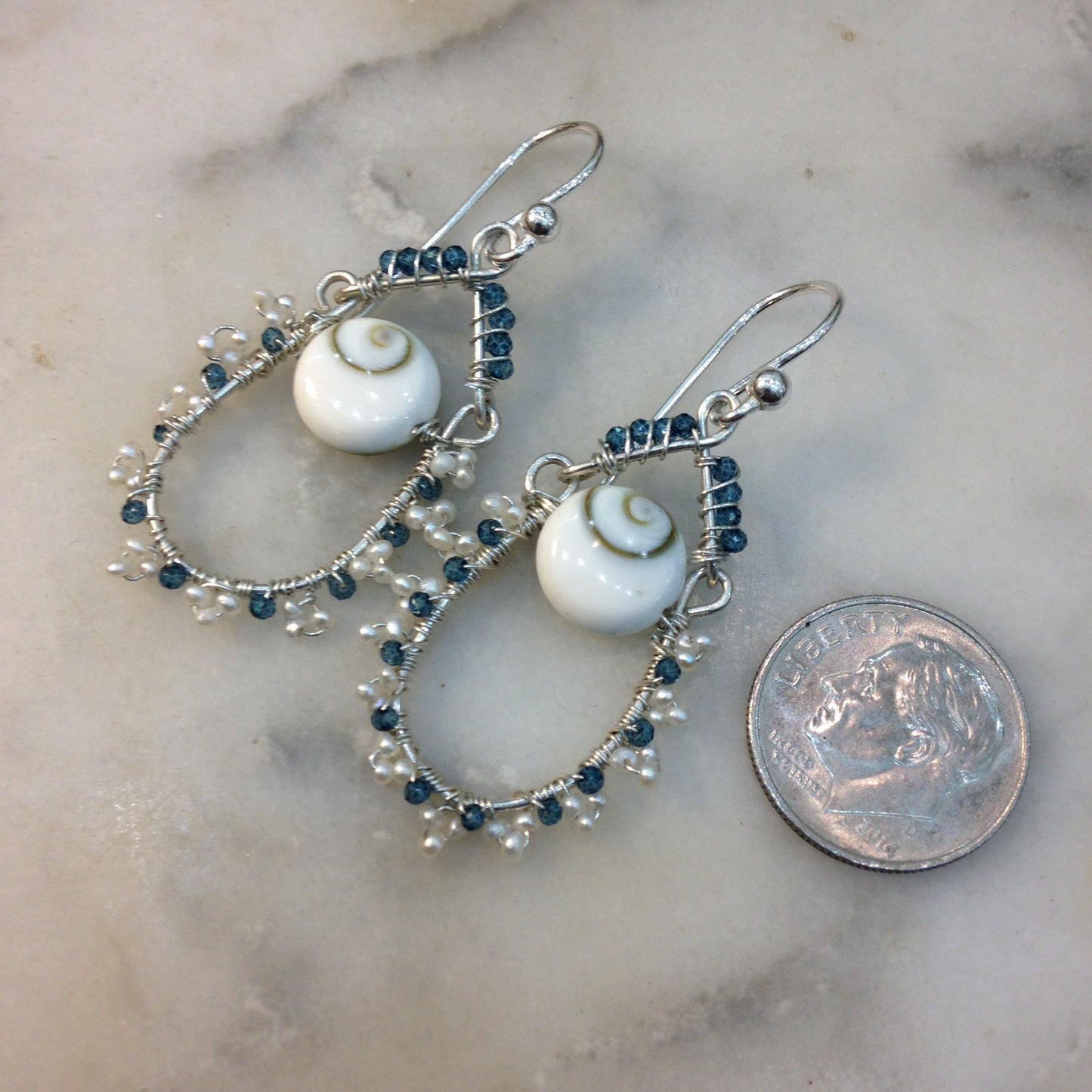 Blue topaz, pearl and lucky eye shell earrings wire wrapped with sterling silver