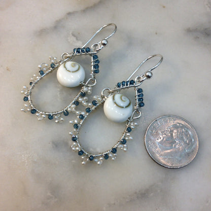 Blue topaz, pearl and lucky eye shell earrings wire wrapped with sterling silver
