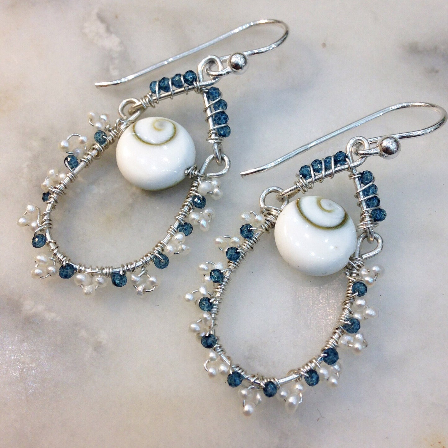 Blue topaz, pearl and lucky eye shell earrings wire wrapped with sterling silver