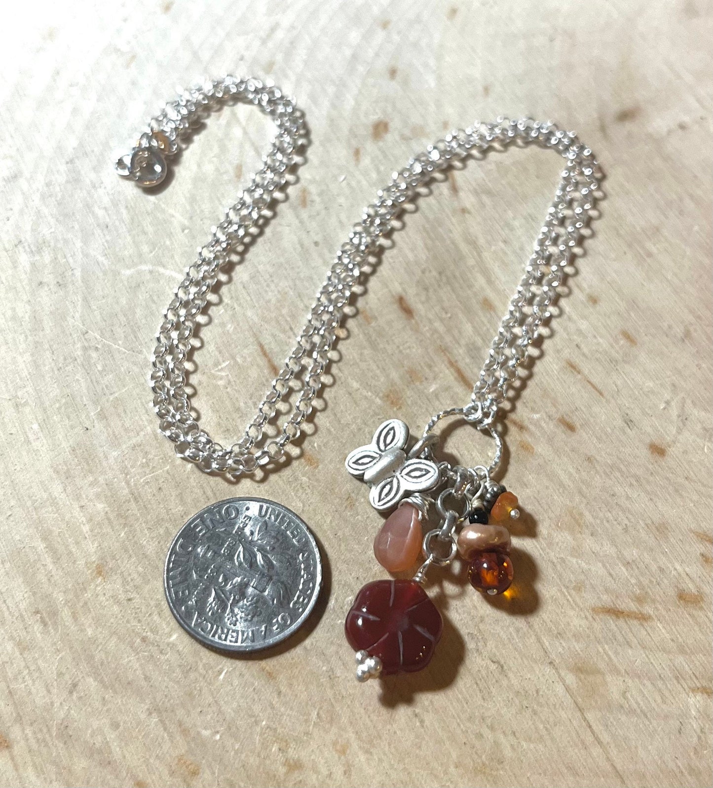 Butterfly Necklace with carnelian flower, peach moonstone, amber, pearls