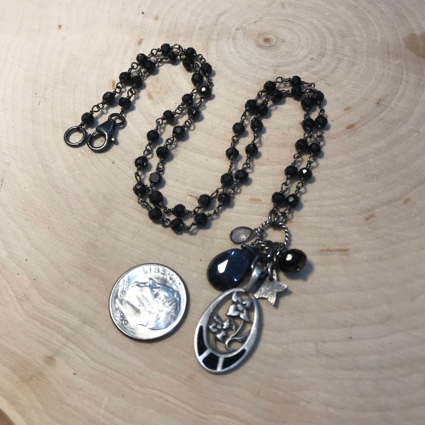 Four Petal Flower necklace with black tourmaline, enamel and sterling silver