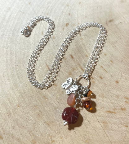 Butterfly Necklace with carnelian flower, peach moonstone, amber, pearls