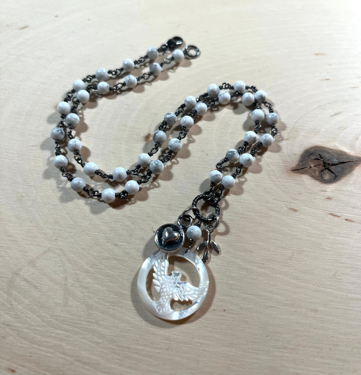 Carved Mother of Pearl Dove necklace with sterling silver