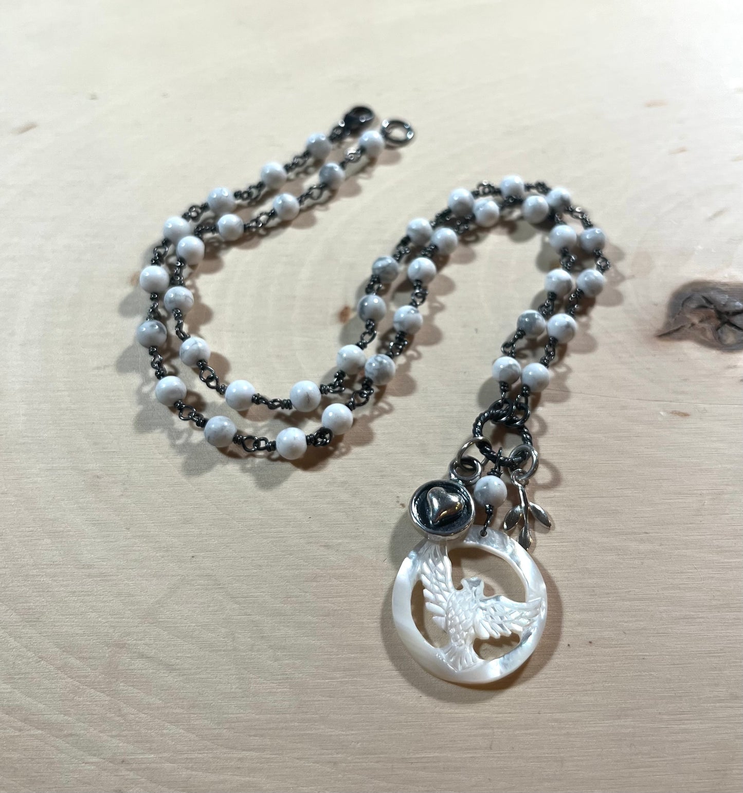 Carved Mother of Pearl Dove necklace with sterling silver