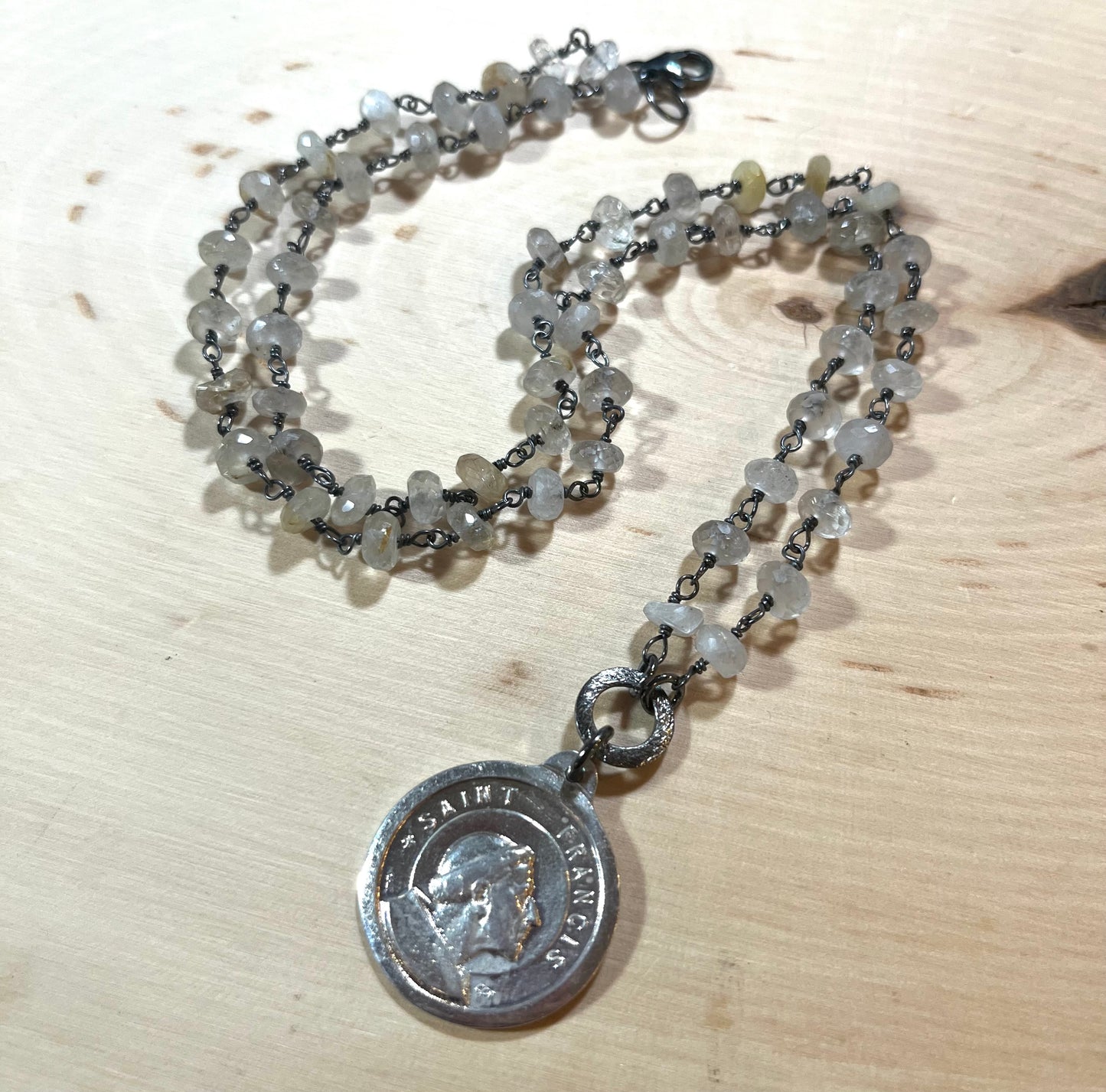Vintage Saint Francis/Saint Anthony necklace with rutilated quartz