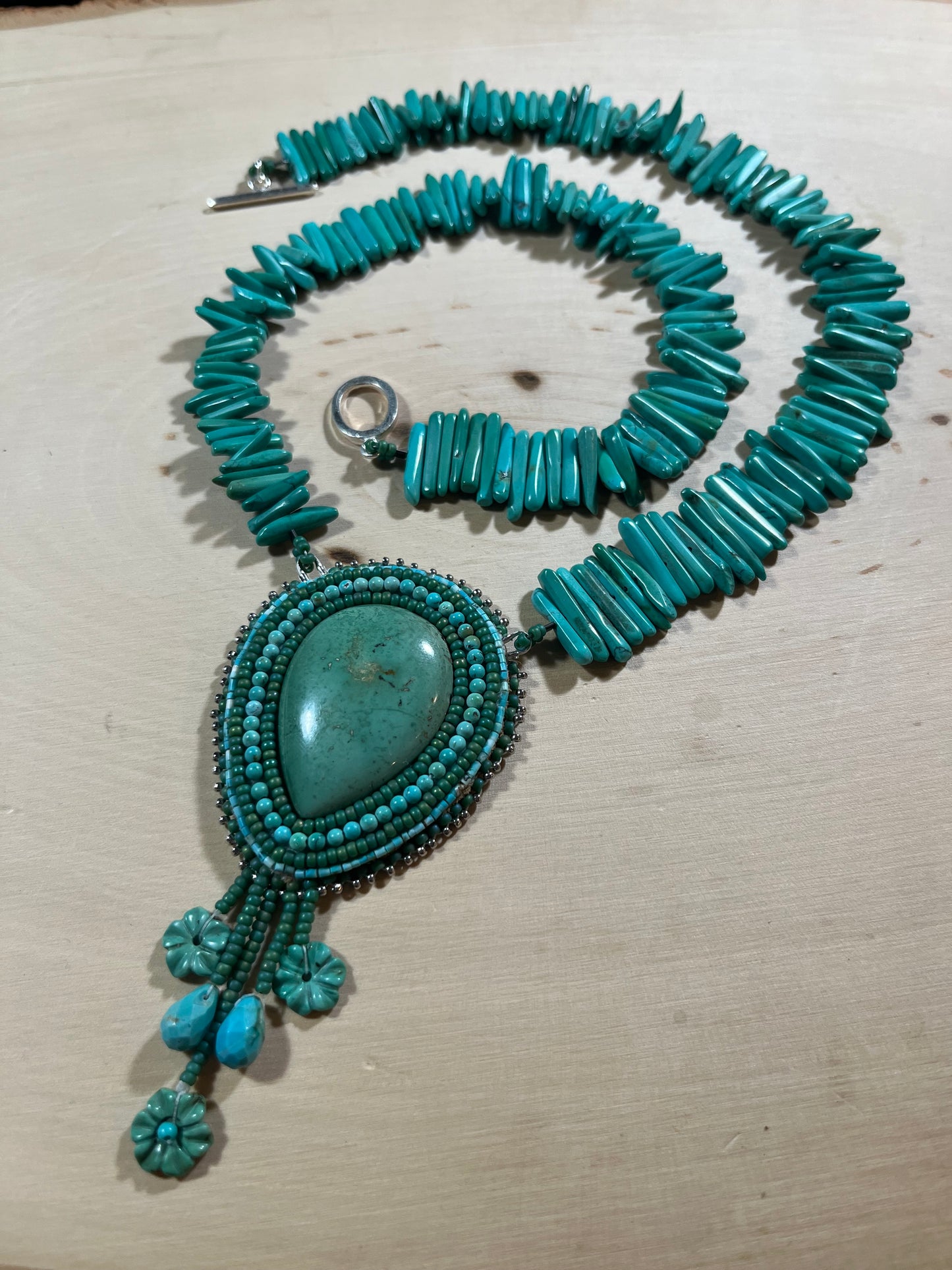 Turquoise beaded necklace with flower drops