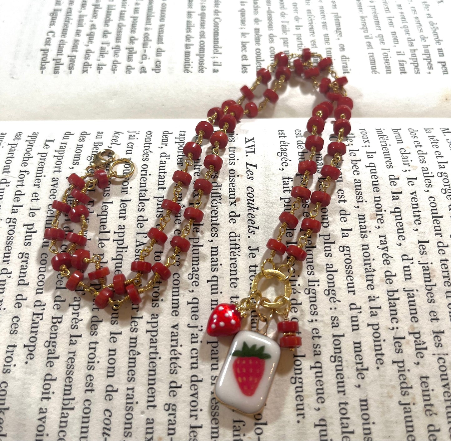 Strawberry necklace with Sha Parle pottery charm, coral, enamel charm and 14k gold-filled