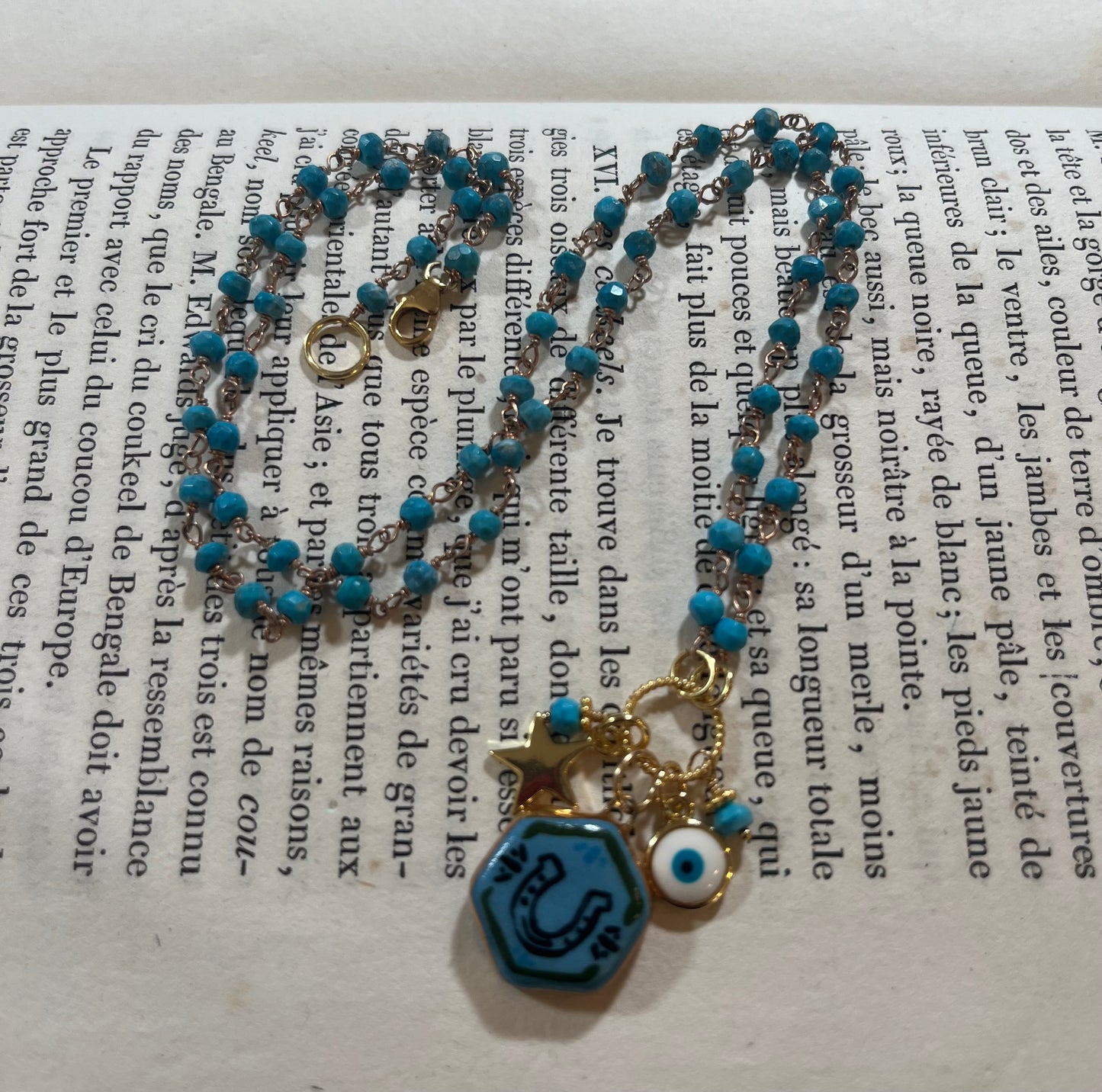 Horseshoe necklace with Sha Parle pottery charm, turquoise, enamel charm and 14k gold-filled