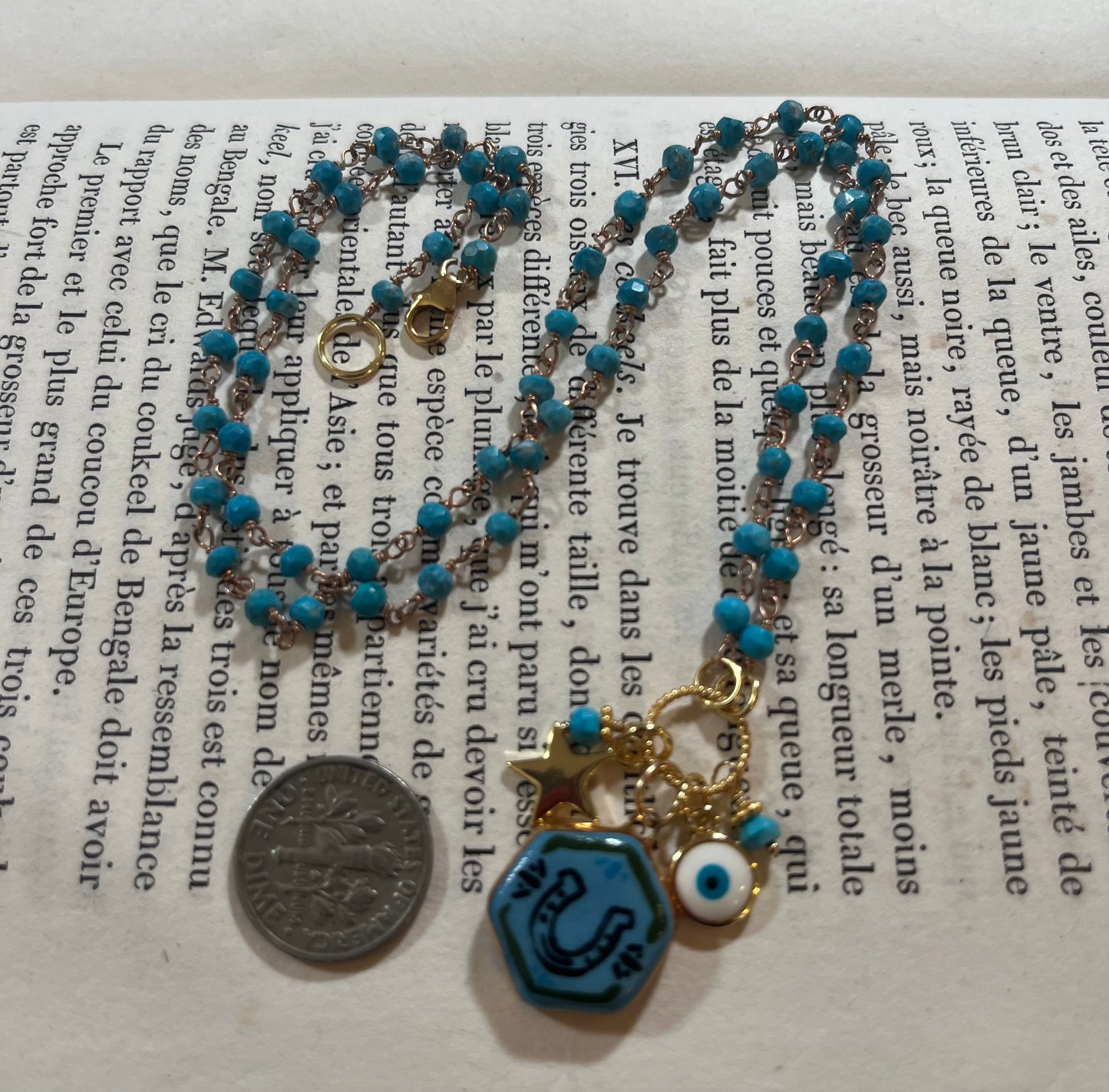 Horseshoe necklace with Sha Parle pottery charm, turquoise, enamel charm and 14k gold-filled