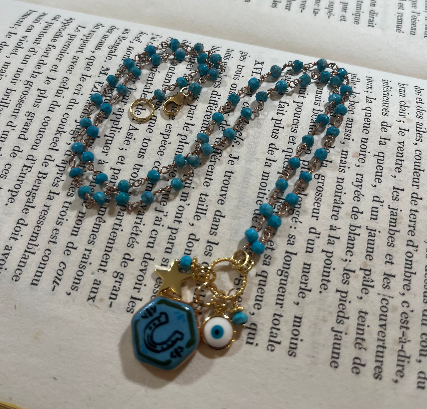 Horseshoe necklace with Sha Parle pottery charm, turquoise, enamel charm and 14k gold-filled