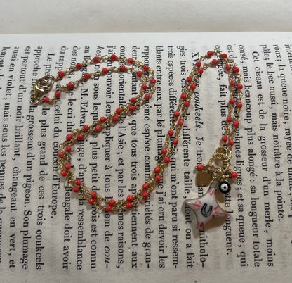 Horseshoe Star necklace with Sha Parle pottery charm, coral, evil eye charm and 14k gold-filled