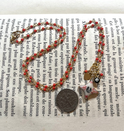 Horseshoe Star necklace with Sha Parle pottery charm, coral, evil eye charm and 14k gold-filled