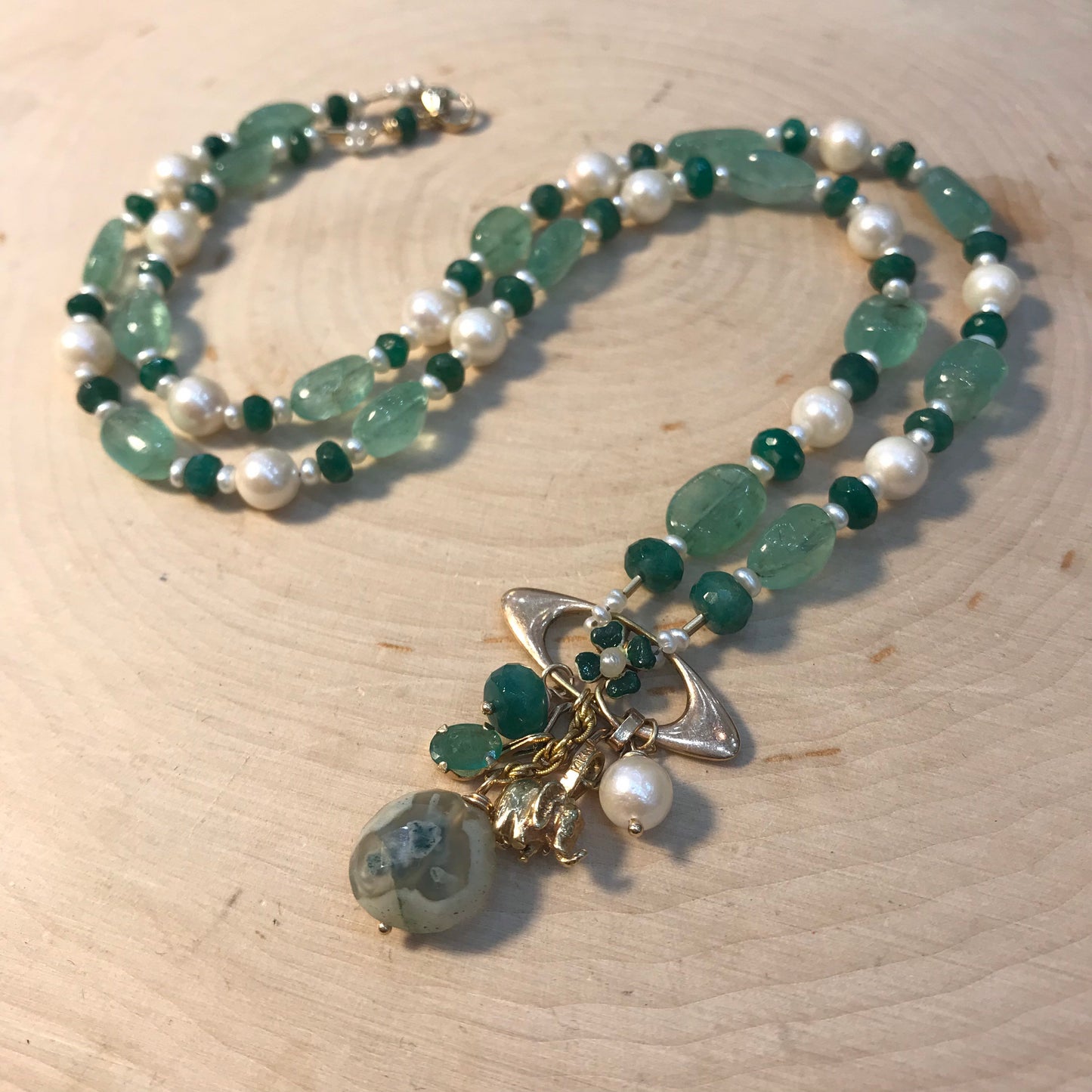 Art Nouveau 14 gold Good Luck necklace with enamel 4 leaf clover, gold elephant, emeralds and pearls